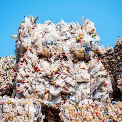 Cubes of compressed plastic garbage at a waste recycling factory